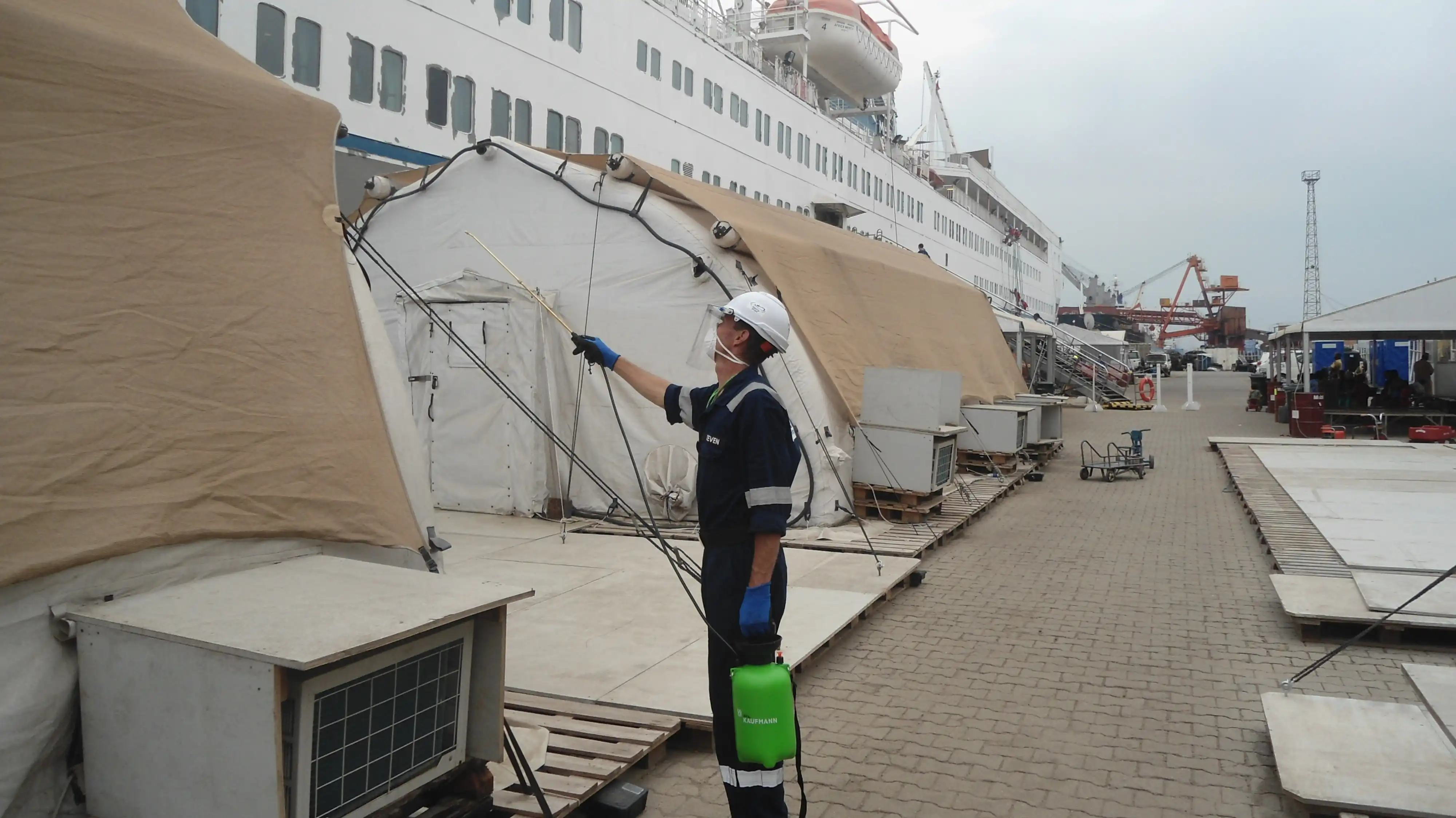 EHS Worker Disinfecting Hospital Tents